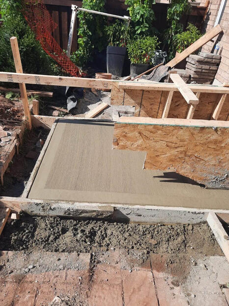 Pouring concrete in stair frame